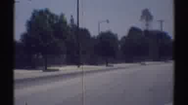 Woodland Hills California (1969): Driving Fast Past Near Cars Trees & Light Poles