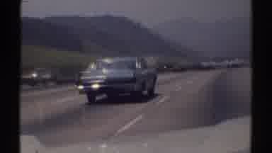 Woodland Hills California (1969): Approaching View Of Blue Car Traveling On