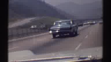 Woodland Hills California (1969): Passenger Filming Classic Car Racing Along