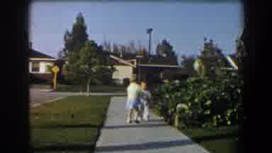California (1958): Two Little Kids Walking On The Sidewalk Of A Street On A Nice