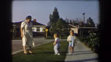 California (1958): Grandmother And Grandchildren On Suburban Sidewalk