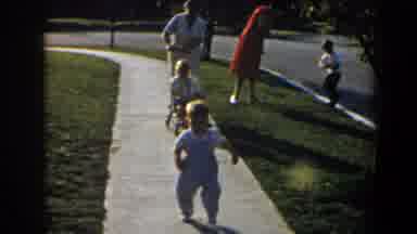 California (1958): A Boy Run Towards A Dog Backing While His Parents And Siblings