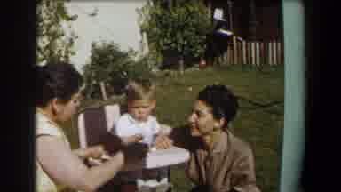 California (1958): Two Women Feed A Baby