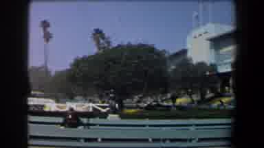 California (1958): An Old Lady Wearing A Red Dress Over A Mechanical Stair Going