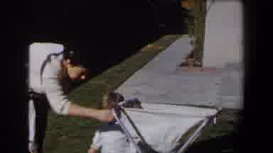 California (1958): A Woman Talking To Her Son While Her Husbands Arrives