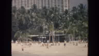 Hawaii (1961): View Of White Building And Green Palm Trees On Beach On A Sunny Day