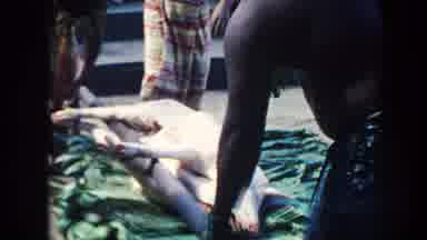 Hawaii (1961): A Party With Lots Of People Present With Music And A Pig To Roast