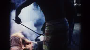 Hawaii (1961): People Watch Natives While They Steam Meat Using A Rock