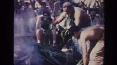 Hawaii (1961): Men Burning Leaf Of A Tree With Many People Around Possibly For An