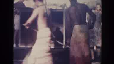 Hawaii (1961): Men In Africa Dressed In Bathrobes Shoveling Dirt Into Container