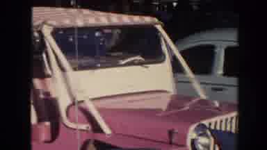 Hawaii (1961): Pink And White Jeep Parked Next To Light Blue Volkswagen Beetle