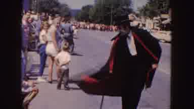 South Dakota (1954): A Man In Creepy Face Paint And A Cape In A Parade