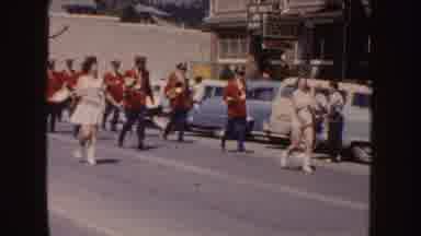 South Dakota (1954): Marching Band In Downtown Street Following Female Majorettes