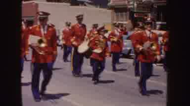 South Dakota (1954): Marching Band Dressed In Red Coats And Blue Pants Followed By