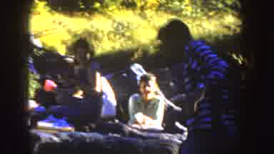 South Dakota (1954): Man Walking In A Park With People Having A Picnic