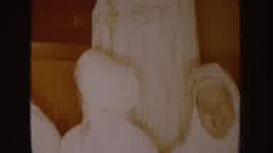 South Dakota (1954): A Person Standing In All White Garments Over Shorter People