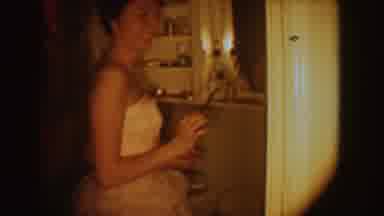 South Dakota (1954): A Beautiful Woman Dressed In A White Gown In The Kitchen To