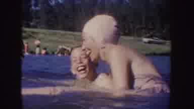 South Dakota (1954): Young Woman With Swimming Cap Playing With A Young Boy In A
