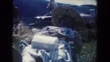 South Dakota (1954): Woman In A Dress With A Large Hat In Lying In The Sun Next To