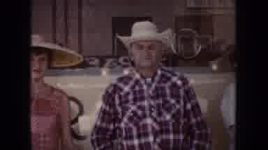 South Dakota (1954): Man And Woman Wearing Hats Having A Get Together With Others