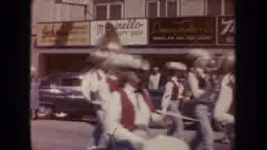 South Dakota (1954): Marching Band With Brass And Percussion Parading Down Street
