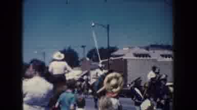 South Dakota (1954): A Woman Chases After A Man On A Horse In A Parade