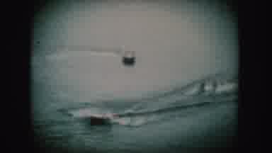 South Dakota (1954): A Boat On Water Speeds By Another Boat With Skiers At The