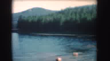 South Dakota (1954): Peaceful Lake With A Small Boat Sailing Across Its Calm
