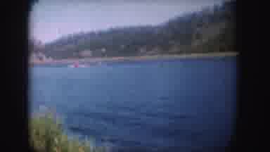 South Dakota (1954): Red Speed Boat On Blue Lake Water On A Bright Sunny Day