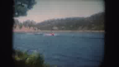 South Dakota (1954): Two Girls Having Fun Surfing Holding A Boat In A Lake