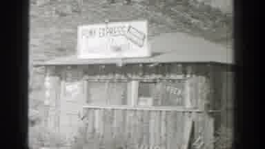 Wyoming (1939): An Old Building Of An Auto shop Located In The Middle Of A
