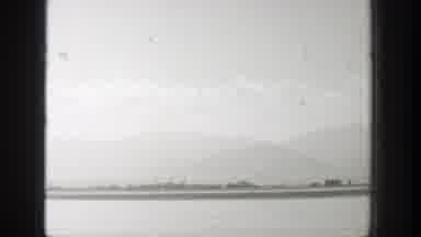 Wyoming (1939): Black And White Video Of Silver Plane Flying Over Runway