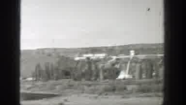 Wyoming (1939): A Large Concrete Dam In What Appears To Be A Large Forest