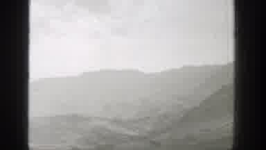 Wyoming (1939): Passing View Of Mist Covered Mountains On A Cloudy Day