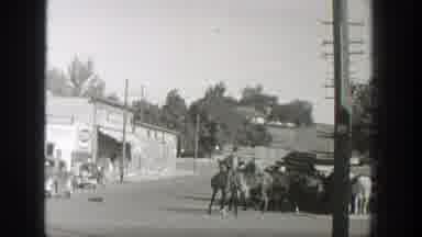 Wyoming (1939): A Guy Riding A Trained Horse And Pulling Two Other Horses At A