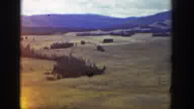 Wyoming (1939): A View Of A Big Field With Some Mountains At The Background And