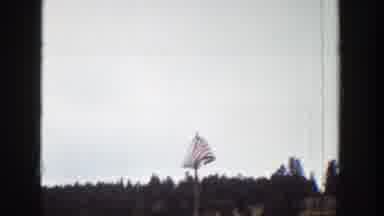Wyoming (1939): American Flag Waving During An Outdoor Ceremony In Front Of A