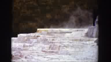 Wyoming (1939): A Classic Black Automobile Drives By A Snow Covered Mountain In