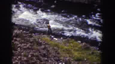 Wyoming (1939): Person Wearing Brown Shirt Stands Near Rushing River On A Sunny