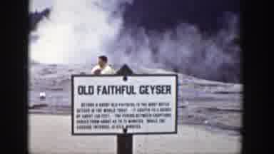 Wyoming (1939): A Group Of People Passing Behring A Sign The Reads Old Faithful