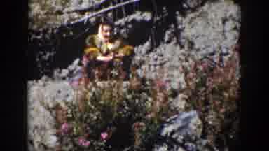 Wyoming (1939): A Woman Sitting On The Stone And A Man Standing With A Sword In