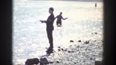 Wyoming (1939): Men Fishing Near The Shore While One Of Them Smokes