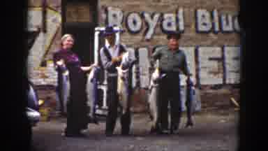 Wyoming (1939): Two Men And A Woman Holding Hefty Sharks In Their Hands