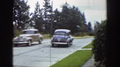 Wyoming (1939): A Yellow Car Stranded By And A Black Car Turning A Corner