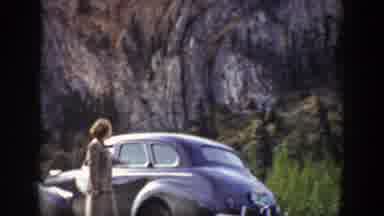 Wyoming (1939): A Woman Stands Beside Her Car To Look Up At The Rocky Mountains
