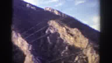Wyoming (1939): A View Of A Mountain And Electric Wires An Old Train Pass At The