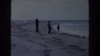 Miami Florida (1960): Three People Standing In Empty Beach On A Clear Day
