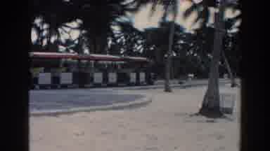 Miami Florida (1960): A Team Moves Through A Tropical Resort To Cabanas On A Trail