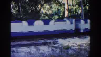 Miami Florida (1960): Blue And White Amusement Park Train Cars Rolling Down The