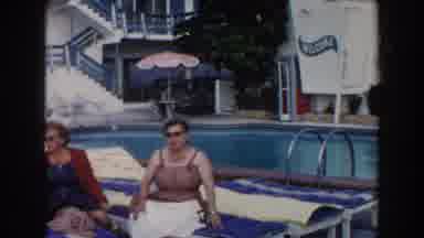 Miami Florida (1960): Two Women Sunbathing Beside A Pool And Chatting With Each